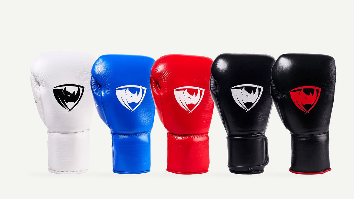PROLAST PG Professional boxing gloves in Columbian white, cobalt blue, crimson red, charcoal black and black with red, side by side