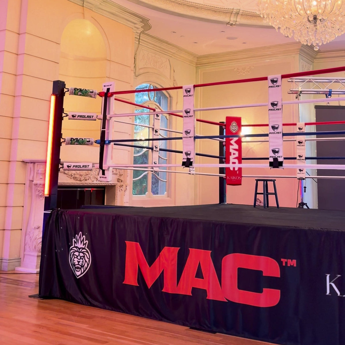 PROLAST boxing ring with red corner pads in a ballroom