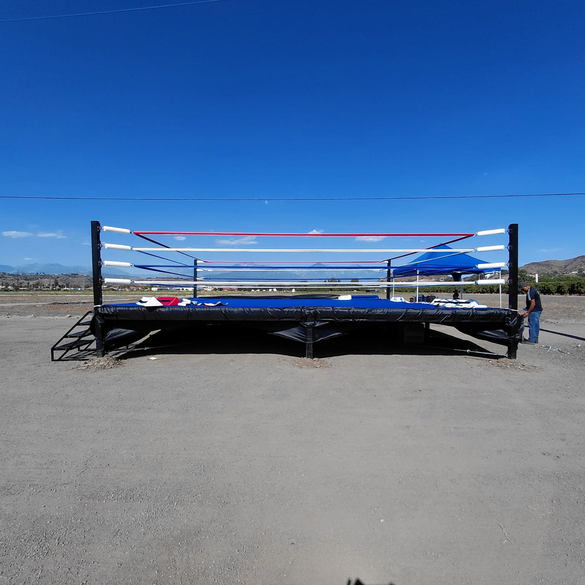 PROLAST boxing ring with a blue canvas set up outdoors