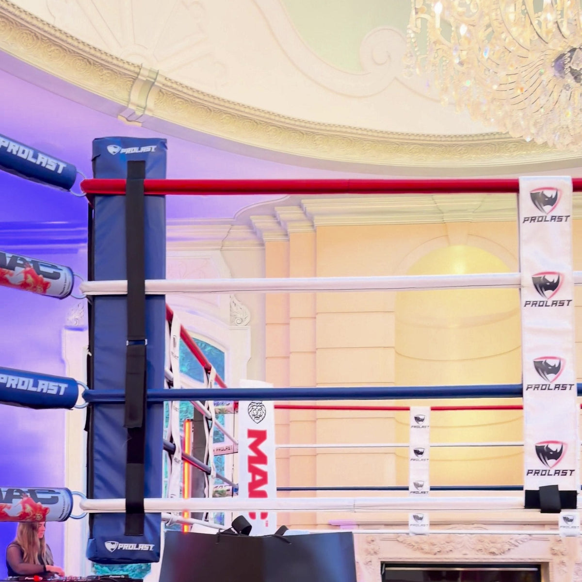 PROLAST rope spacers and turnbuckle covers on red, white and blue boxing ring ropes
