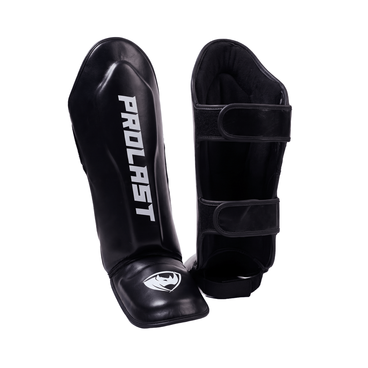PROLAST deluxe Muay Thai shin guards in black, pair close up on white showing the instep logo and padded lining