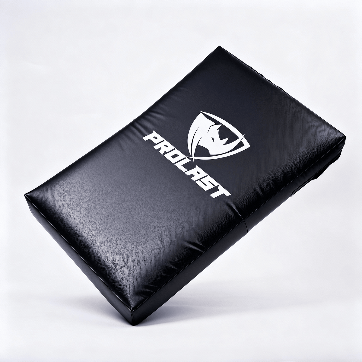 PROLAST kick shield in black, tilted on one corner with the PROLAST rhino logo across the front