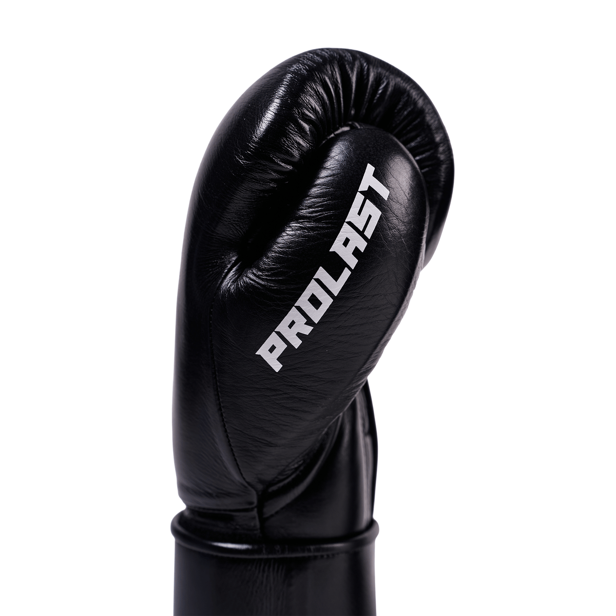 PROLAST PG professional boxing gloves in charcoal black, close-up of one glove's thumb side with PROLAST lettering