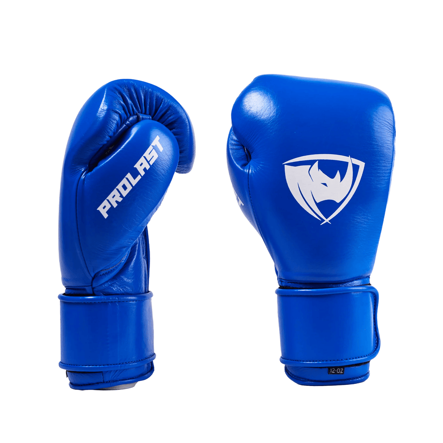 PROLAST PG professional boxing gloves in cobalt blue with Velcro strap, pair showing the PROLAST thumb side and rhino logo
