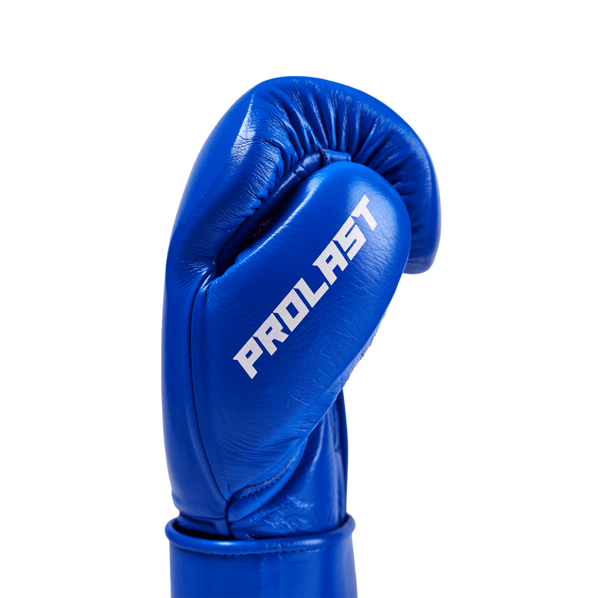 PROLAST PG professional boxing gloves in cobalt blue, close-up of one glove's thumb side with white PROLAST lettering