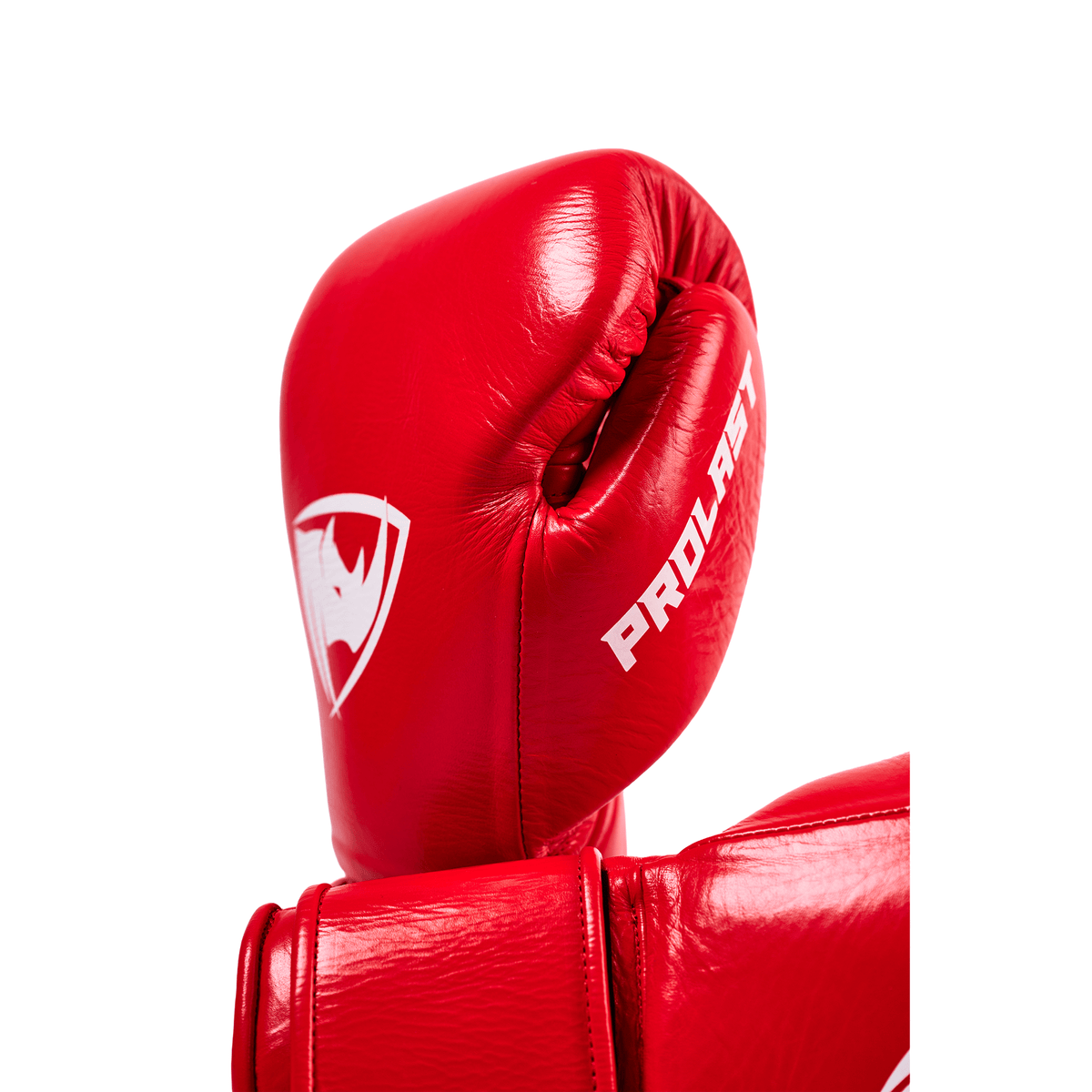 PROLAST PG professional boxing gloves in crimson red, close-up of the upright glove with rhino logo and PROLAST lettering