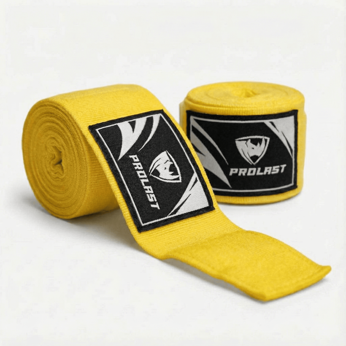 PROLAST 180 in professional boxing hand wraps in brilliant yellow, two rolls, one partly unrolled, with PROLAST rhino labels
