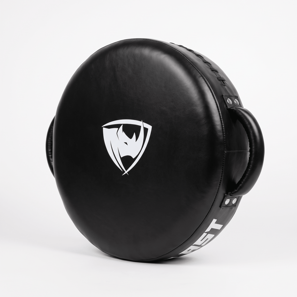 PROLAST round punch shield in black, standing on edge with the white rhino shield logo on the striking face