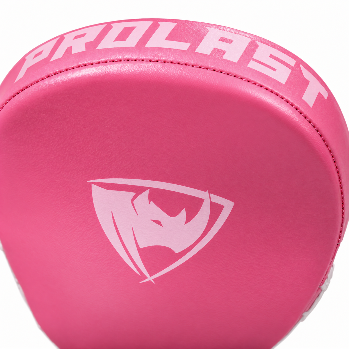 PROLAST pink speed mitt close-up: the light pink rhino shield logo and PROLAST lettering on the striking face