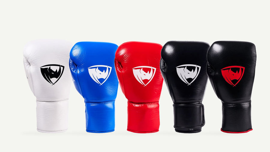 PROLAST PG Professional boxing gloves in Columbian white, cobalt blue, crimson red, charcoal black and black with red, side by side