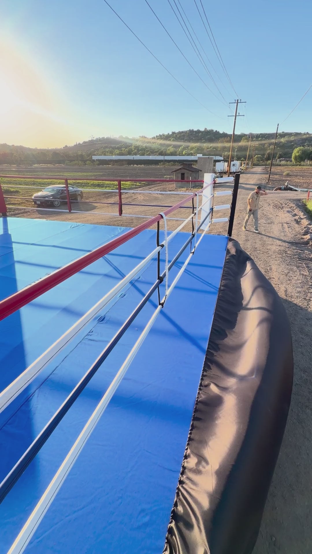 PROLAST boxing ring with a blue canvas outdoors in the sun