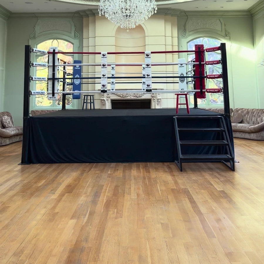 PROLAST boxing ring with stairs in a ballroom under a chandelier