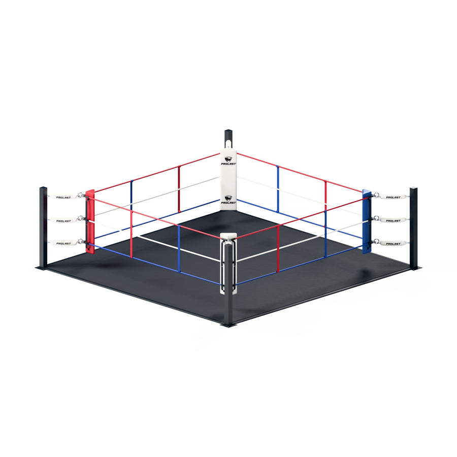 PROLAST floor boxing ring with red, white and blue ropes, PROLAST turnbuckle covers and corner pads on a black canvas