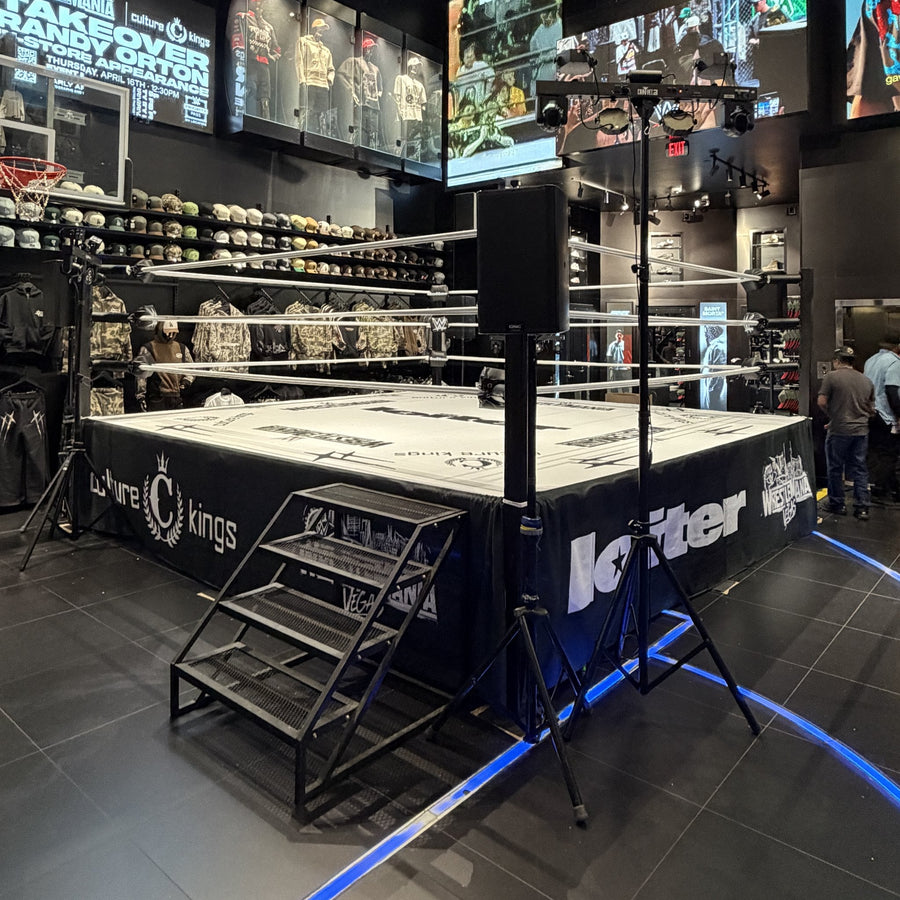 PROLAST boxing ring with stairs and a custom printed skirt in a store