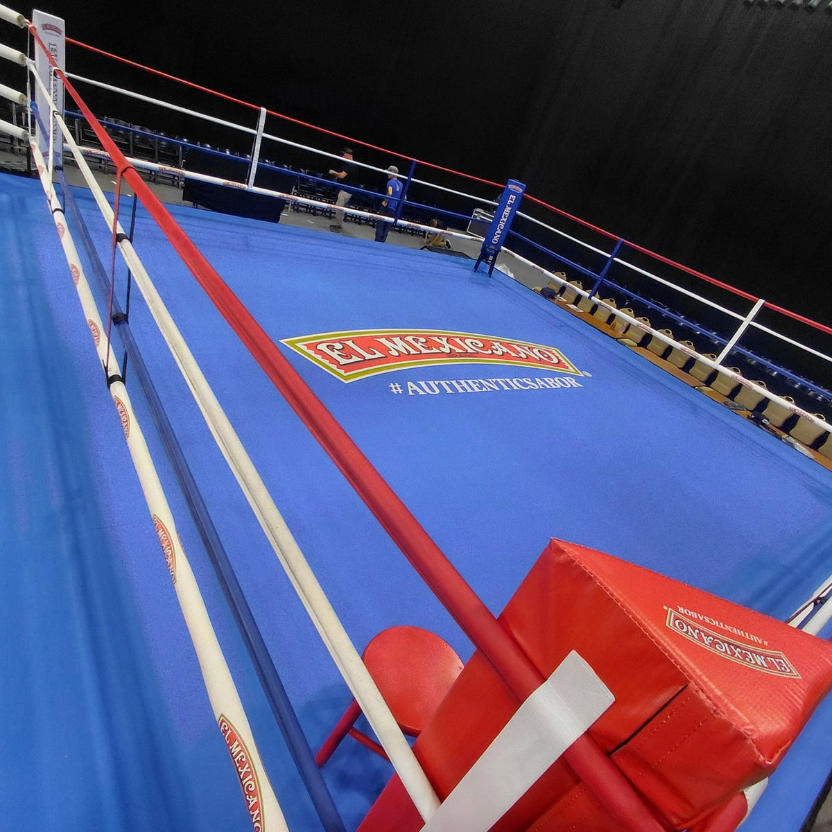 Corner of a PROLAST boxing ring with a blue canvas and red corner pad