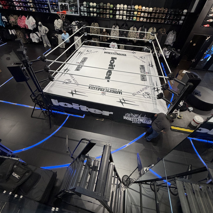 PROLAST boxing ring with a white printed canvas in a retail store, seen from above