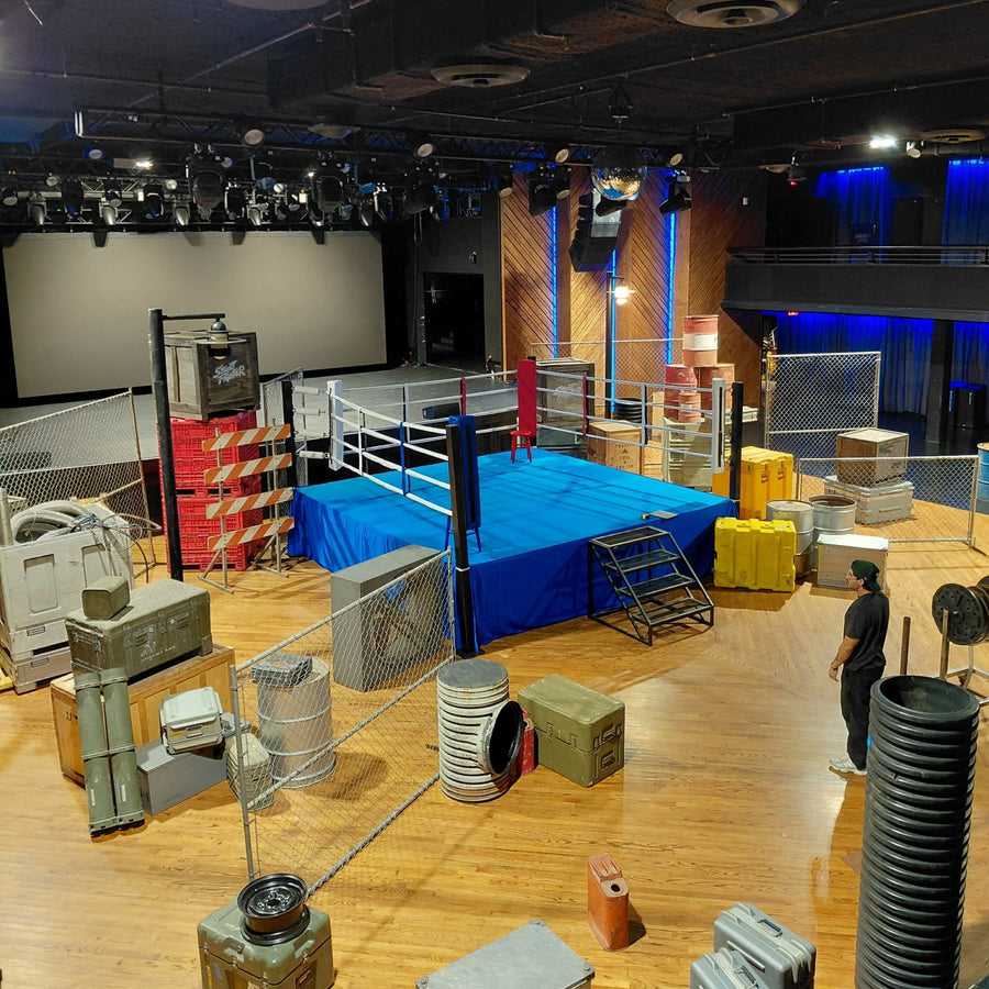 PROLAST boxing ring with a blue skirt on a film set