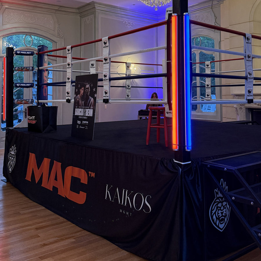 PROLAST boxing ring with red, white and blue ropes in a ballroom, set up for a fight media day