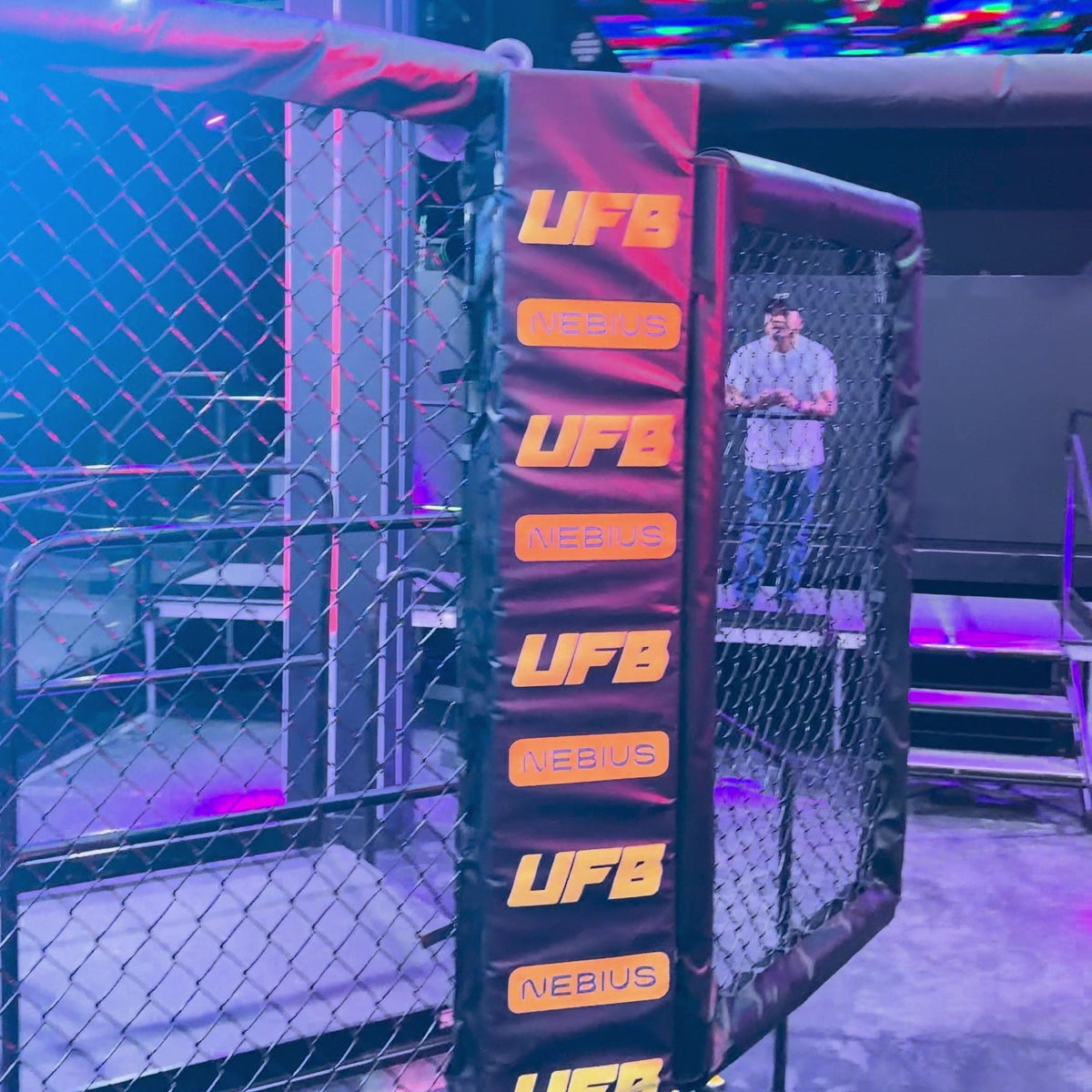 PROLAST MMA cage corner with padded posts at a robot fight night