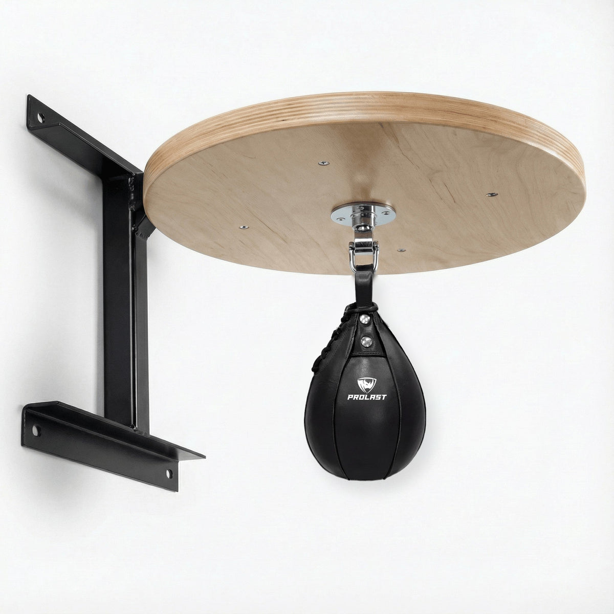 PROLAST black leather speed bag hanging from the PRO ELITE swivel under the PROLAST hardwood speed bag platform