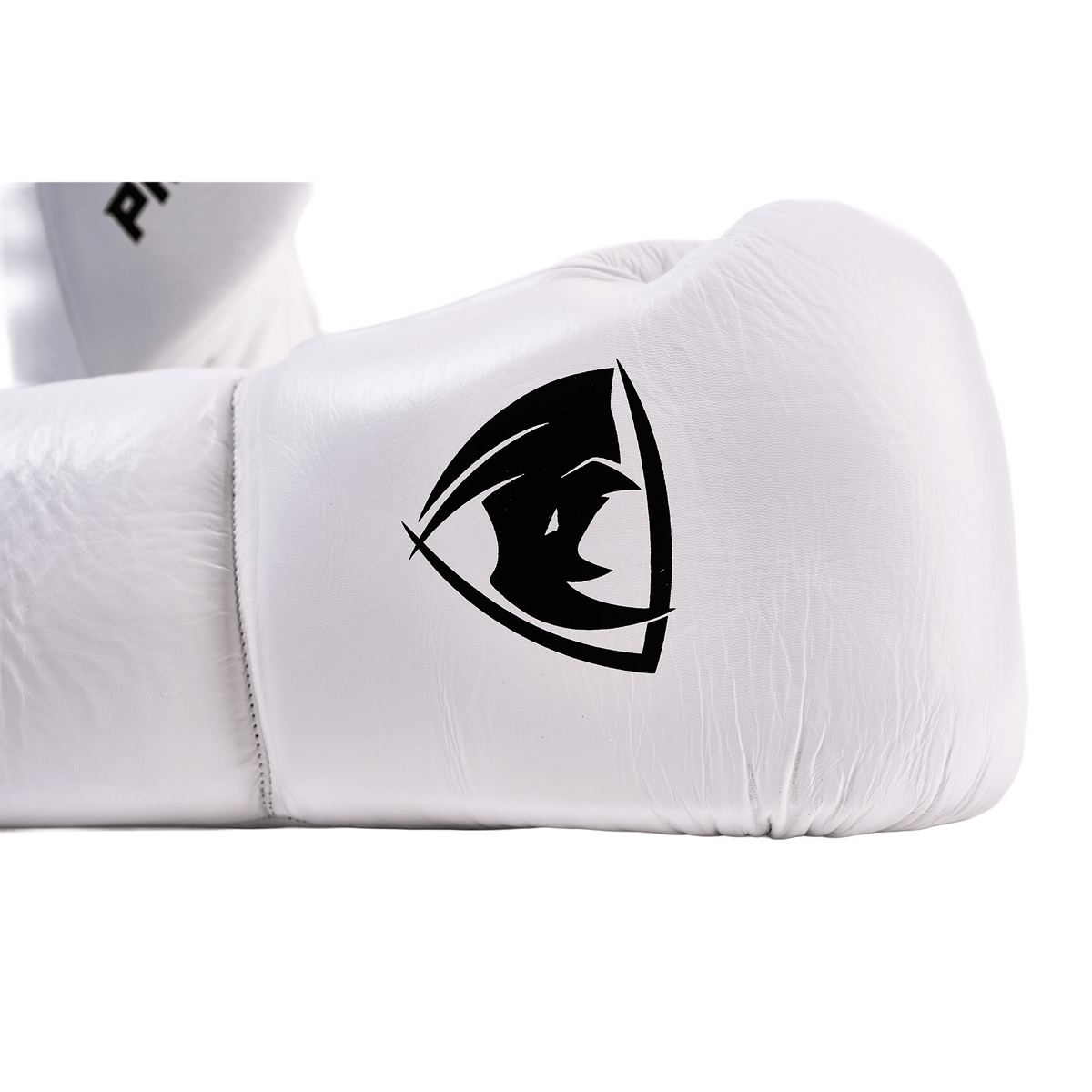 PROLAST PG professional lace-up boxing gloves in Columbian white, close-up of the black rhino logo on the lying glove
