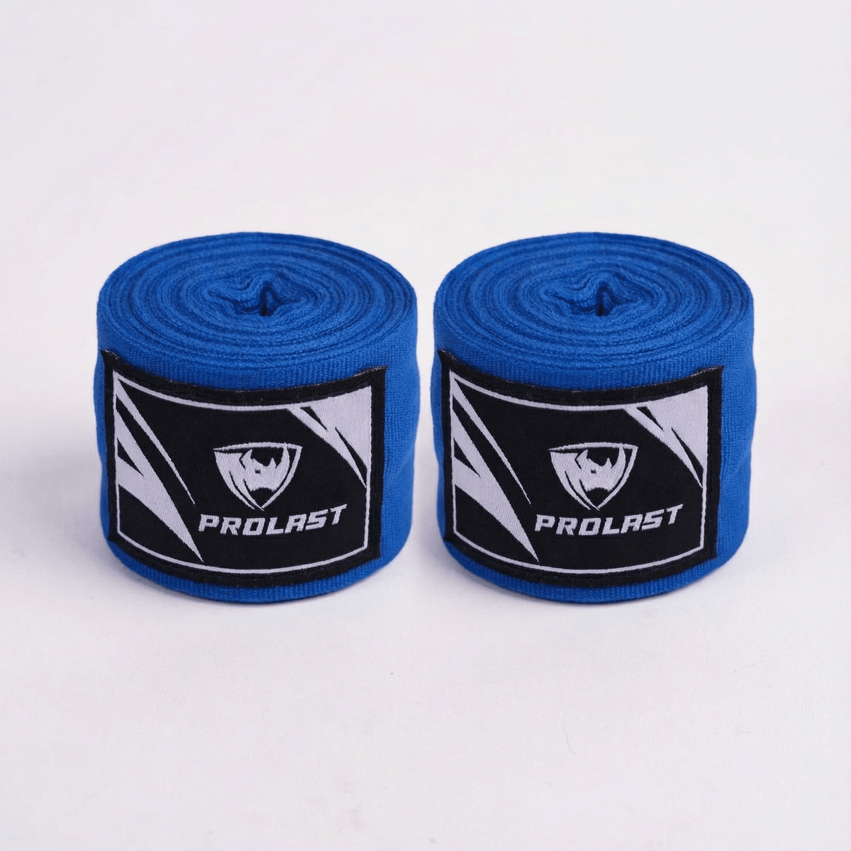 PROLAST 180 in professional boxing hand wraps in blue, two rolled wraps side by side with PROLAST rhino labels