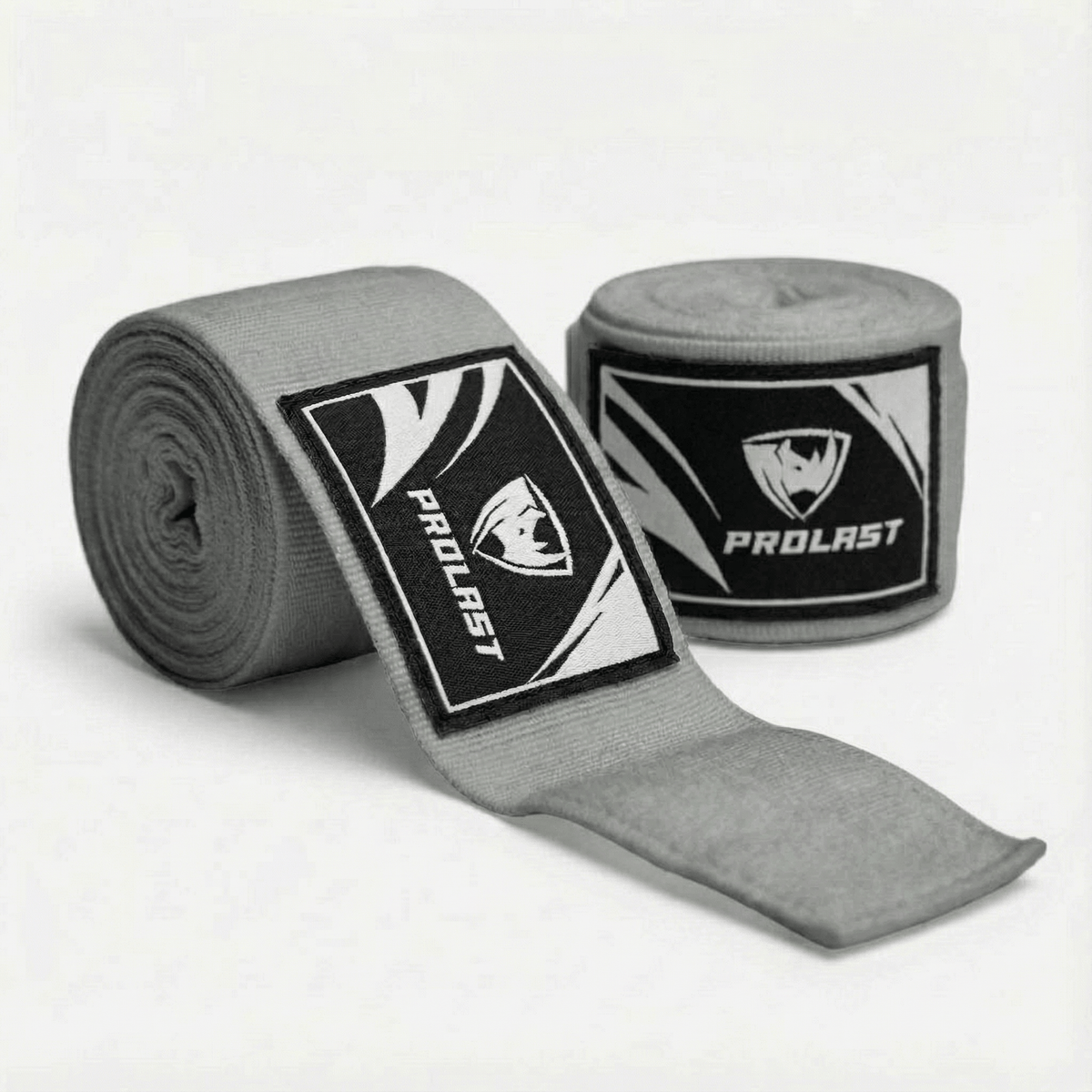 PROLAST 180 in professional boxing hand wraps in Smoke Grey, two rolls, one partly unrolled to show the logo label