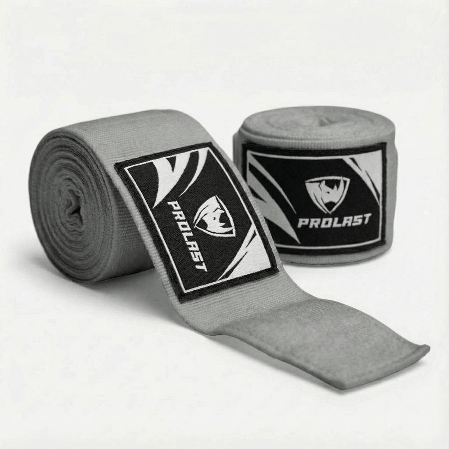 PROLAST 180 in professional boxing hand wraps in Smoke Grey, two rolls, one partly unrolled to show the logo label
