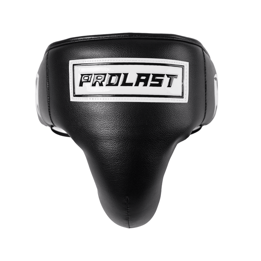 PROLAST professional groin protector in black, front view of the high-cut cup with a raised white PROLAST badge