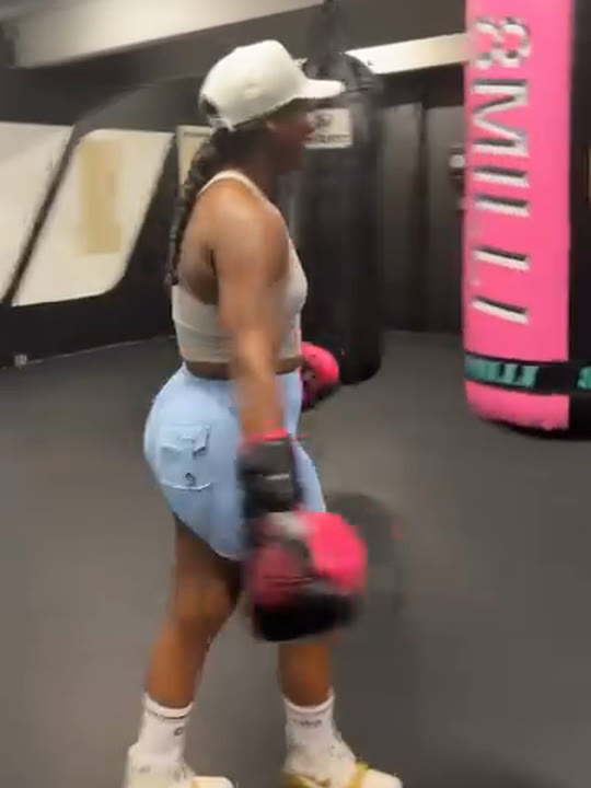 Claressa Shields punching her custom pink and black 8MILLI heavy bag, made by PROLAST