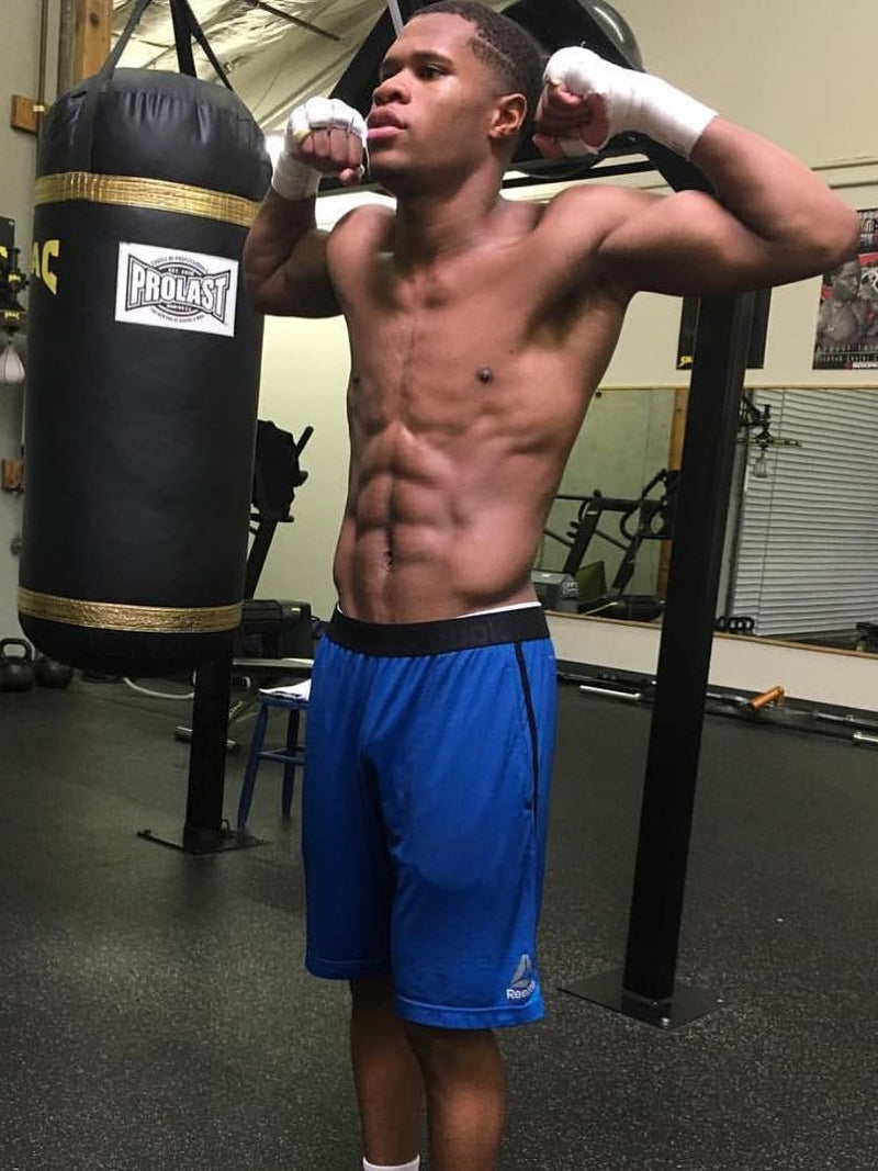 Devin Haney beside a black and gold PROLAST heavy bag in 2018
