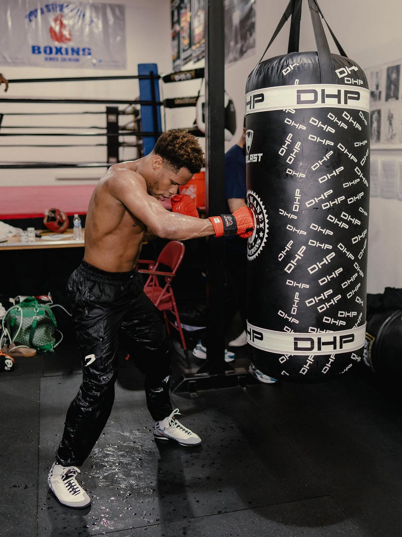 Devin Haney hitting his custom black and white DHP heavy bag, made by PROLAST