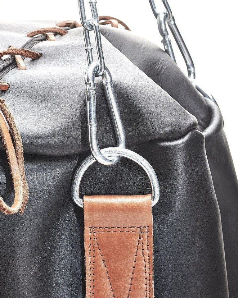The steel chain, clip and D-ring on a black leather PROLAST heavy bag with tan trim